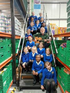 Shinewater pupils filming the video in the foodbank warehouse
